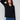 Stylish black sweater featuring a V-neckline and elegant button accents on the sleeves, perfect for any occasion by Charlie B.