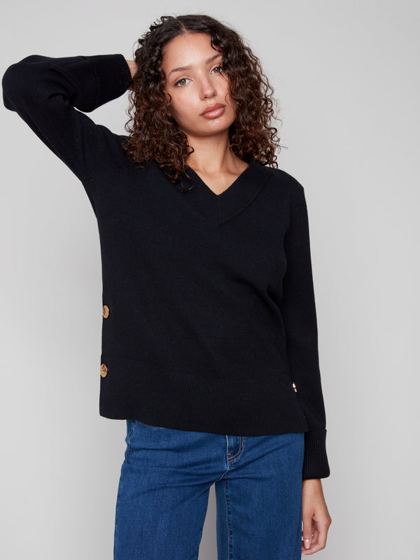 Stylish black sweater featuring a V-neckline and elegant button accents on the sleeves, perfect for any occasion by Charlie B.