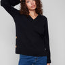 Stylish black sweater featuring a V-neckline and elegant button accents on the sleeves, perfect for any occasion by Charlie B.