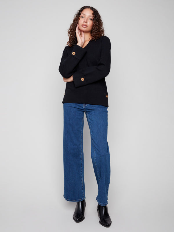Chic black sweater with wide cuffs and button details at the sleeves, offering a sophisticated touch to your wardrobe by Charlie B.