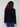 Sophisticated black V-neck sweater adorned with stylish button details on the cuffs, enhancing its modern appeal by Charlie B.