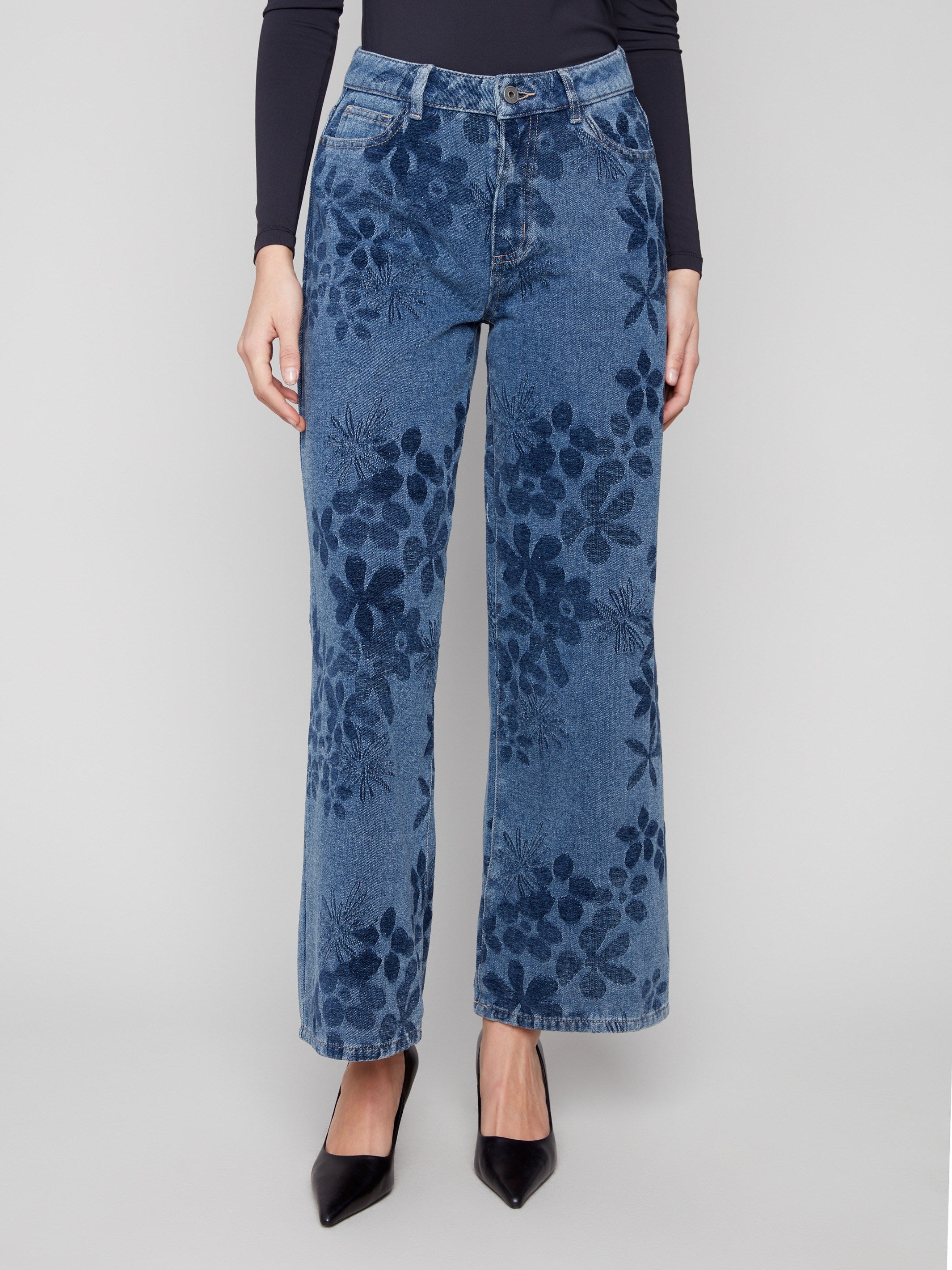 These jeans showcase a classic five-pocket design with a beautiful floral jacquard pattern, adding flair to your outfit by Charlie B.