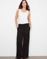 Black wide-leg French terry pants featuring a regular rise and elastic waistband for comfort by Charlie B.