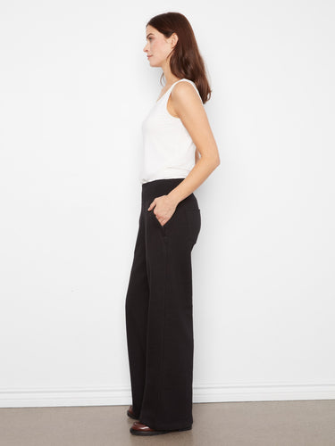 Elegant midnight wide-leg pants showcasing back patch pockets for added flair by Charlie B.