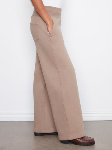 Convenient zip side pockets enhance these pants, combining functionality and fashion by Charlie B.