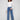 These blue jeans feature a long length and embossed heart pattern, offering a chic style by Charlie B.