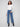 These blue jeans feature a long length and embossed heart pattern, offering a chic style by Charlie B.