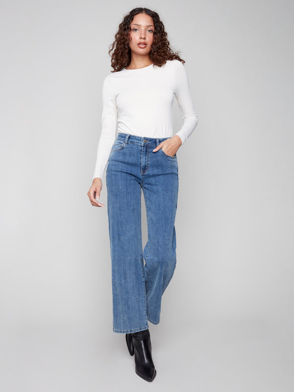Crafted from stretch denim, these blue wide-leg jeans ensure comfort without compromising on style by Charlie B.