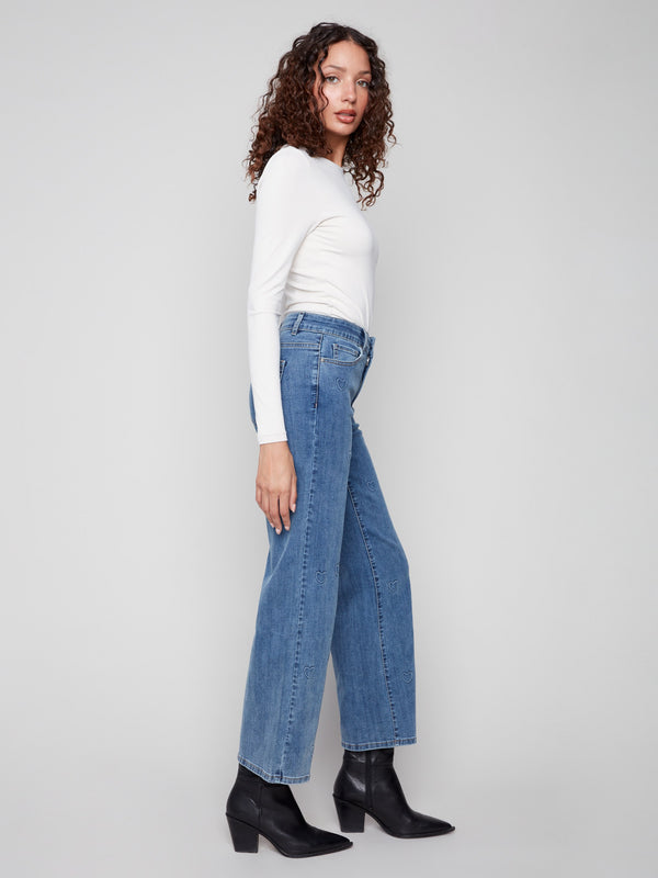 With a regular rise fit, these stylish jeans are adorned with an embossed heart pattern for added charm by Charlie B.