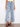 Stylish cropped length denim jeans with intricate pixelated flower embroidery. Perfect for any occasion. By Charlie B.