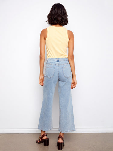 Comfortable stretch denim material with charming pixelated floral accents, ideal for everyday wear. By Charlie B.
