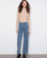 These jeans feature an extra-wide leg design, offering a trendy and comfortable fit by Charlie B.