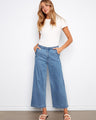 Blue wide-leg jeans with scalloped edges and a flattering regular rise. Crafted from stretch denim for comfort by Charlie B.