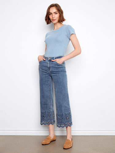 Featuring a regular rise, these jeans offer comfort and versatility with their unique scalloped detailing. Designed by Charlie B.