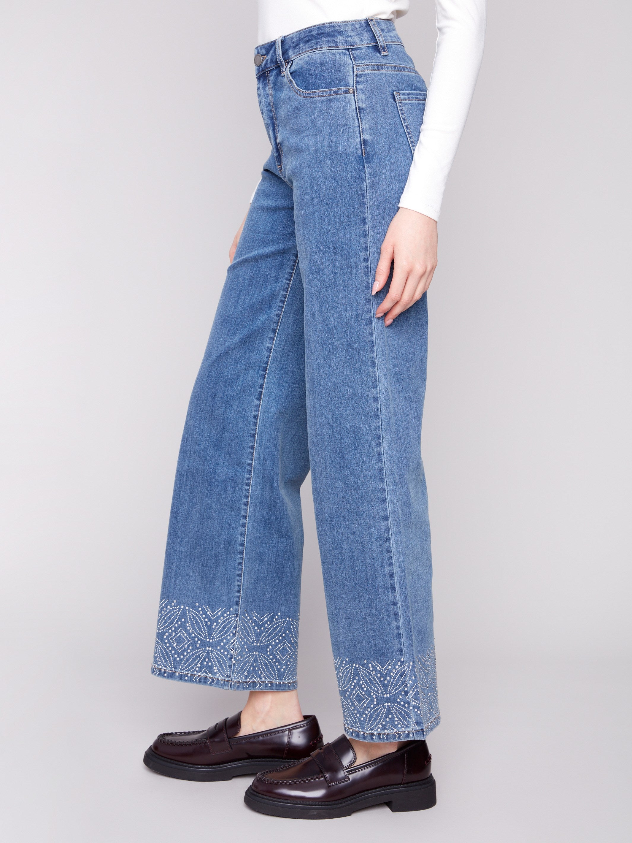 Stylish jeans with a regular rise and intricate patterned studs at the hem for added flair by Charlie B.