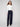 Deep blue jeans with a long length and floral sequin details, offering a chic look by Charlie B.