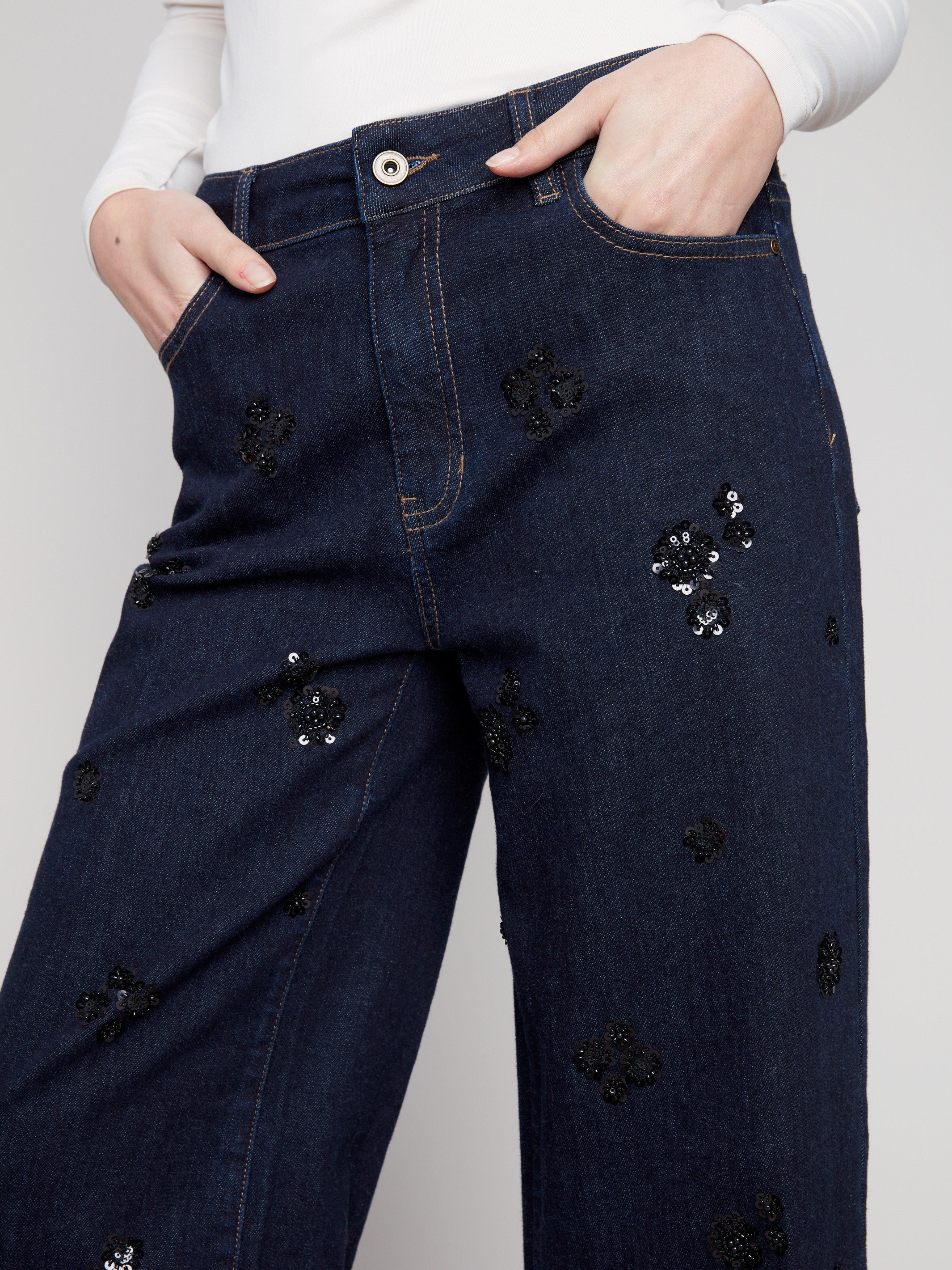 Featuring a regular rise, these deep blue jeans are adorned with subtle sequin accents for added flair by Charlie B.