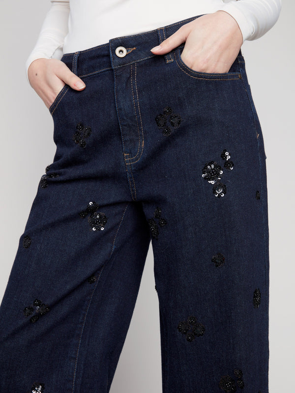 Featuring a regular rise, these deep blue jeans are adorned with subtle sequin accents for added flair by Charlie B.