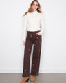 Brown wide-leg pants with a full-length design, featuring floral embroidery and stretch twill fabric by Charlie B.