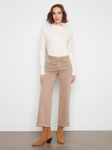 Latte-colored twill fabric wide-leg pants paired stylishly with a white long-sleeve top and ankle boots by Charlie B.
