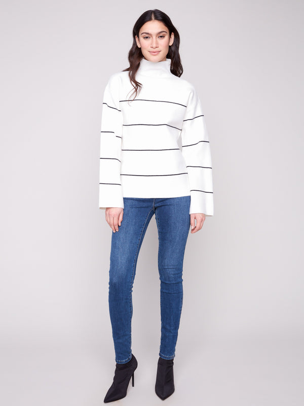 Chic ecru sweater with long sleeves and black stripes, offering a comfortable and stylish look by Charlie B.