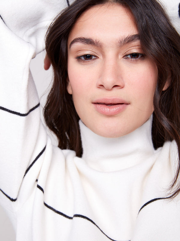Stylish ecru funnel neck sweater adorned with classic black stripes, ensuring warmth and style by Charlie B.