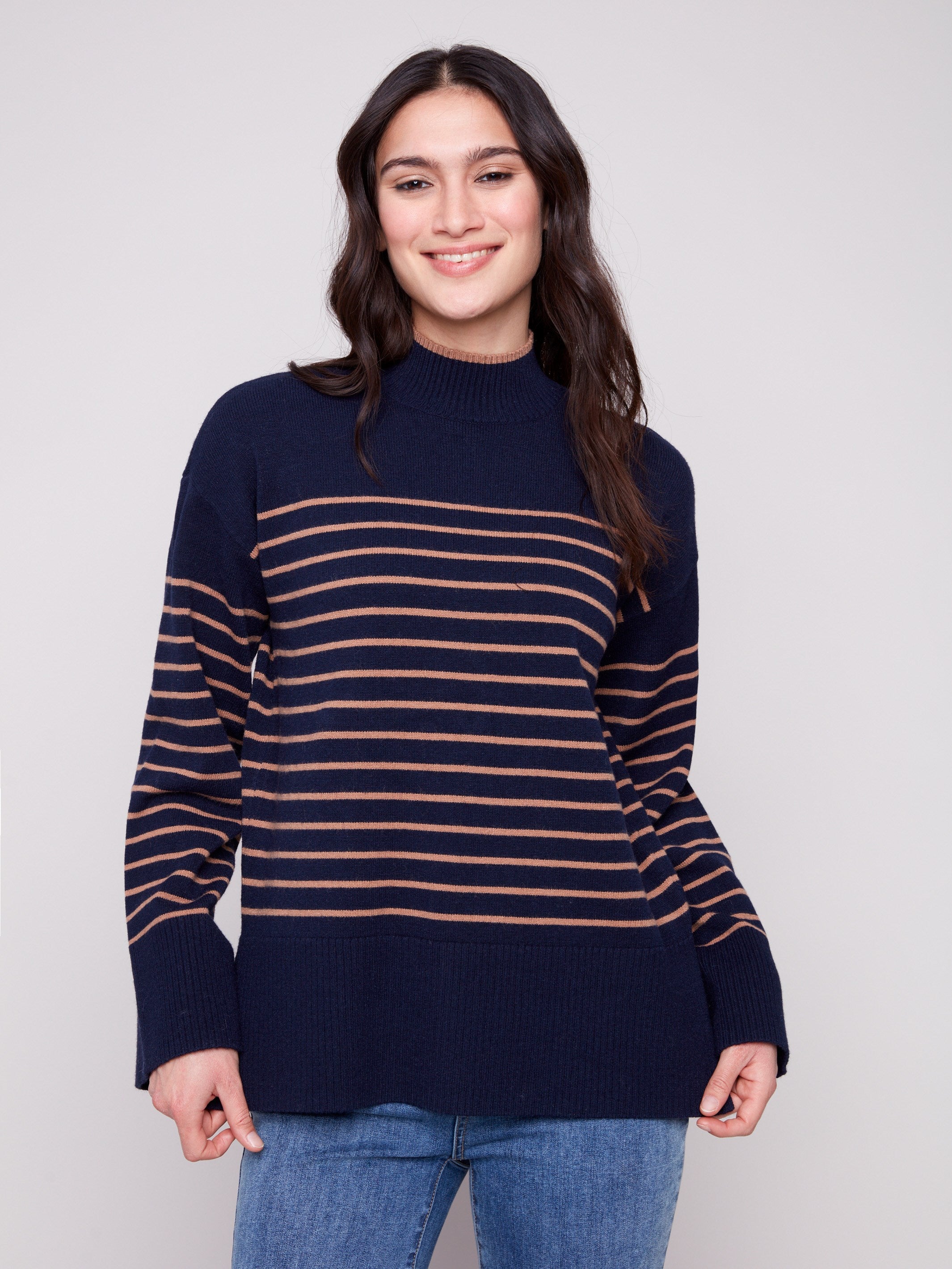 Navy blue striped sweater featuring a chic mock neck design with drop shoulders for a relaxed look by Charlie B.