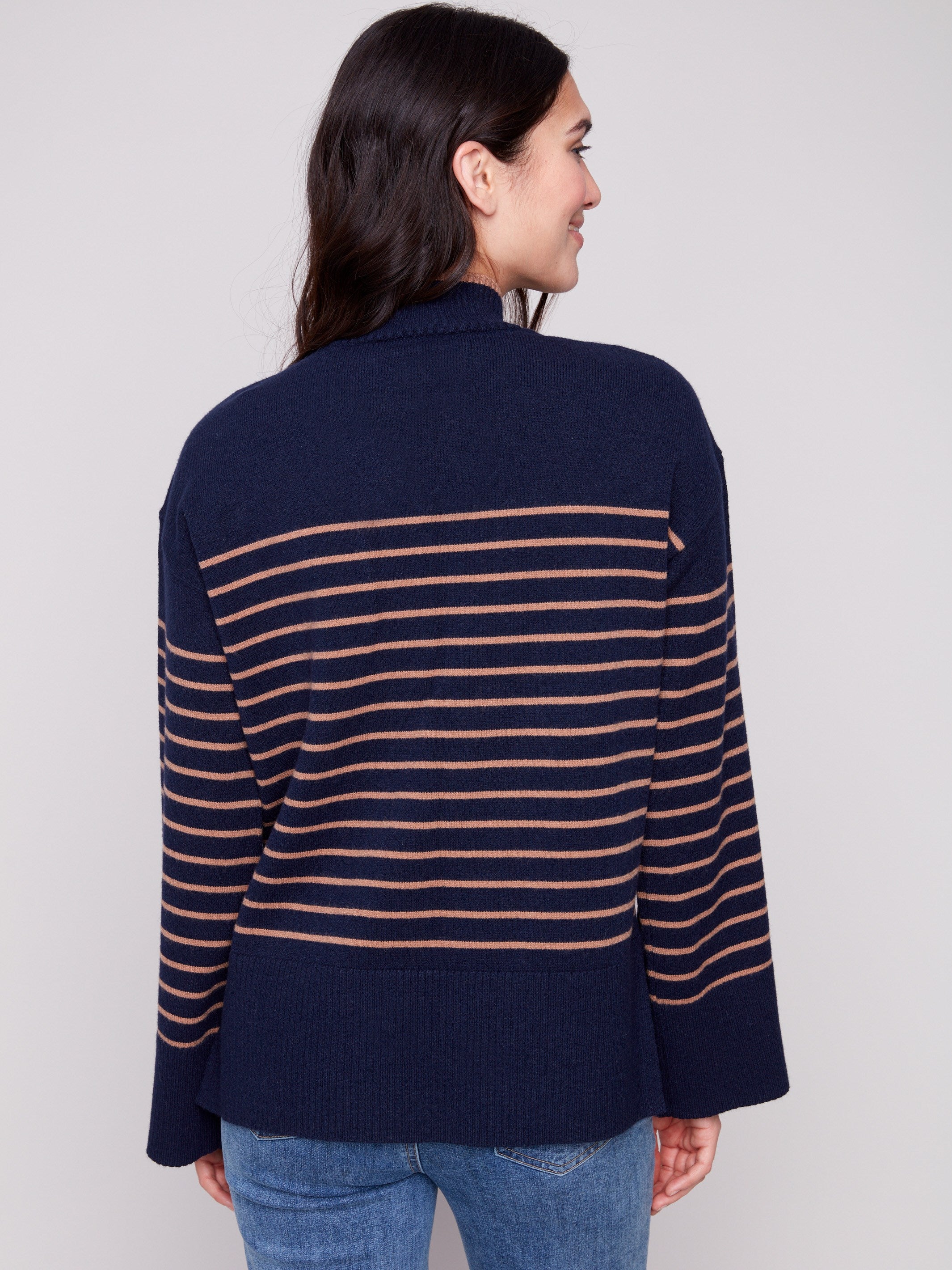 Navy blue striped sweater showcasing unique side slit details, adding flair to any outfit by Charlie B.